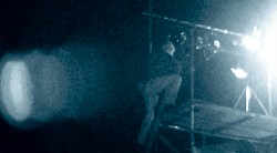 Man climbing to light platform